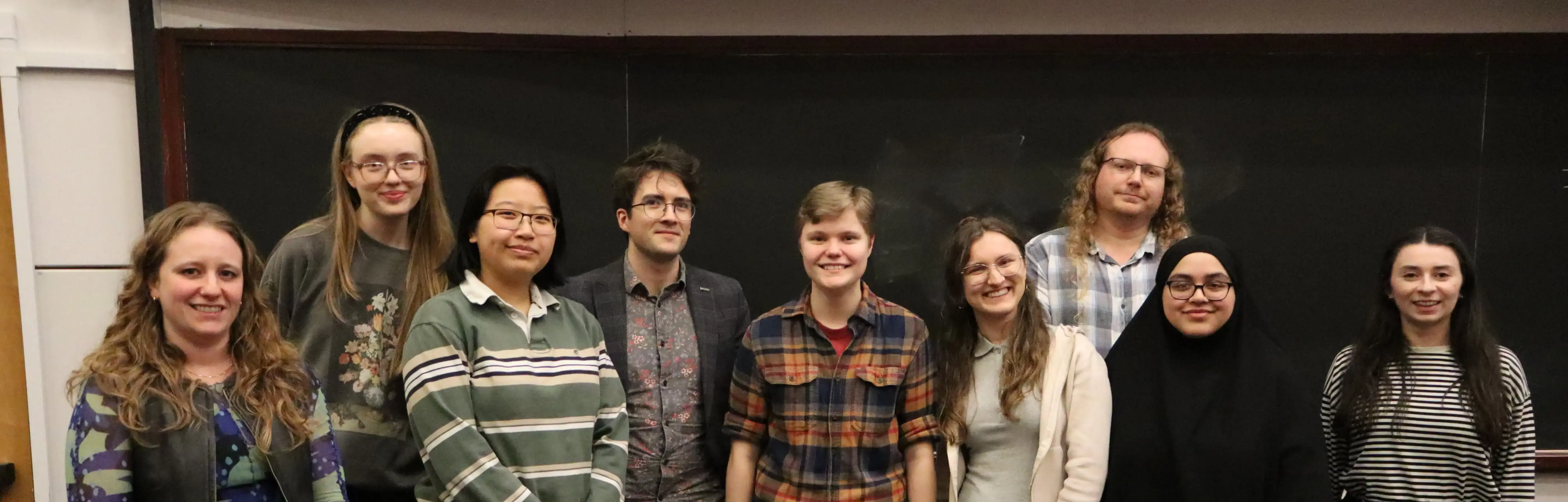photo of MIMUC Committee 2026 standing in front of blackboard.